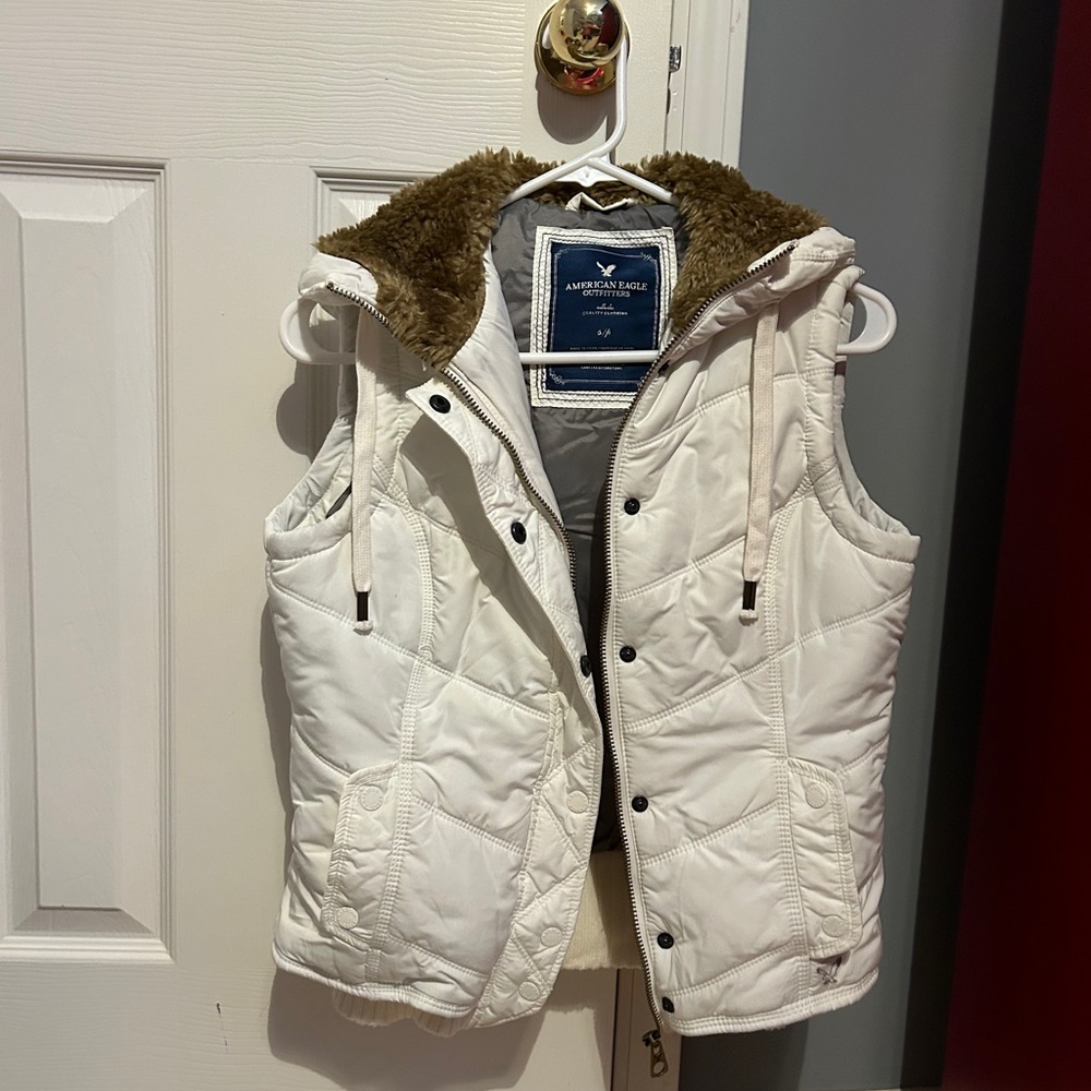 Puffer vest with furry hood